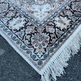 Hand-knotted Persian silk rug