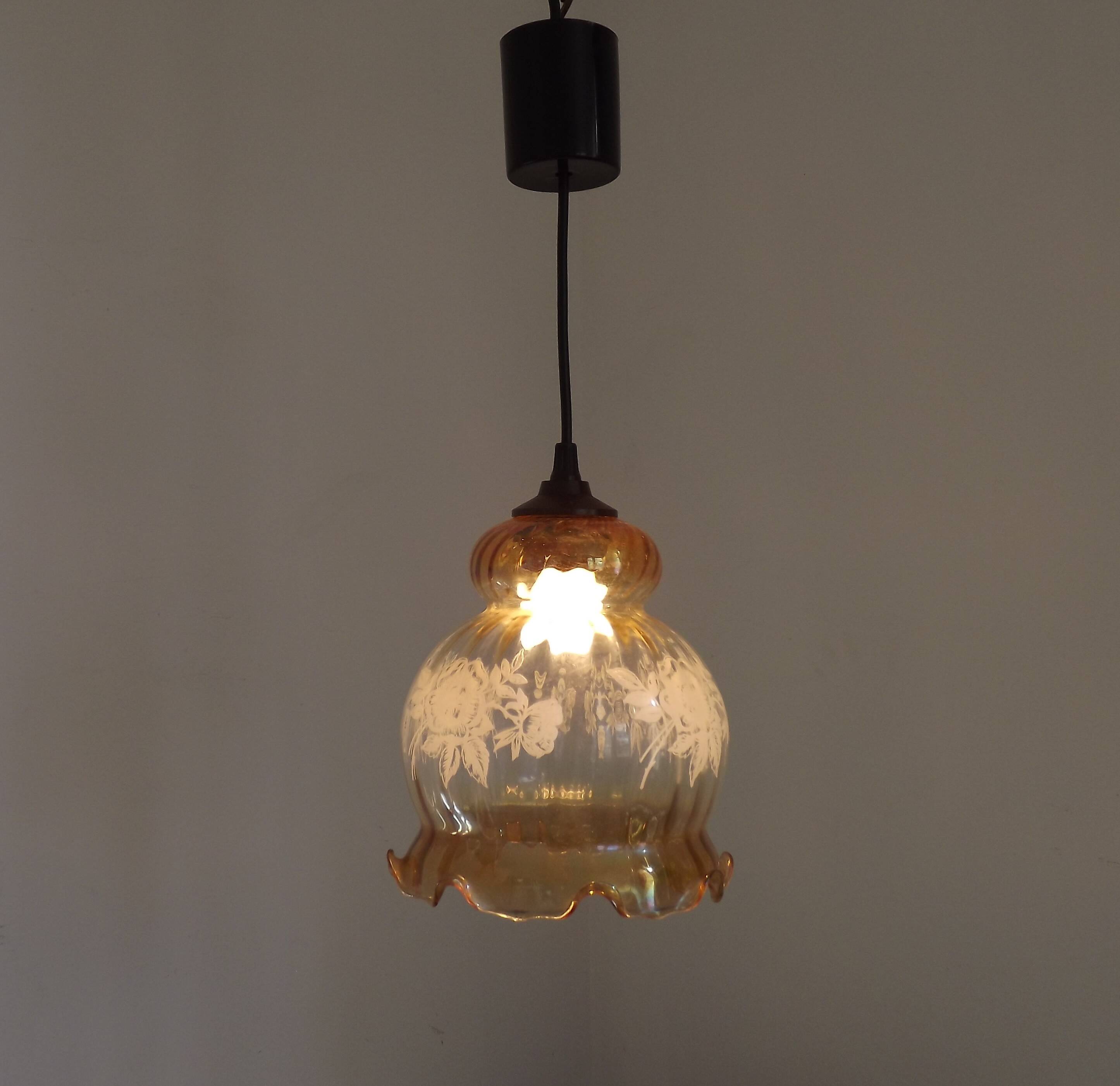 French vintage amber and clear glass ceiling light with white floral decoration.