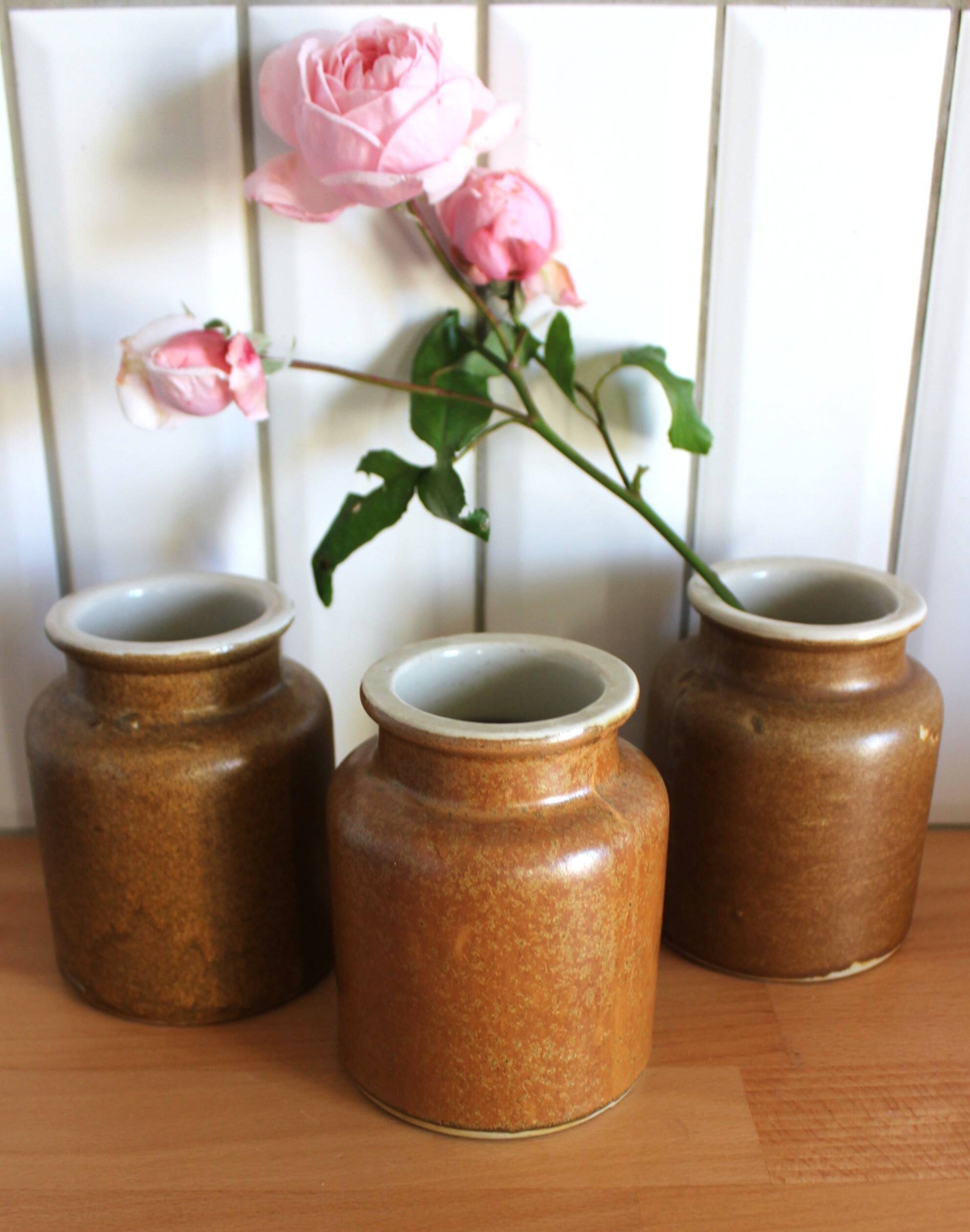 A set of 3 vintage glazed stoneware vases for indoor use.