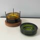 Set of 3 stackable glass catchalls with a teak base.