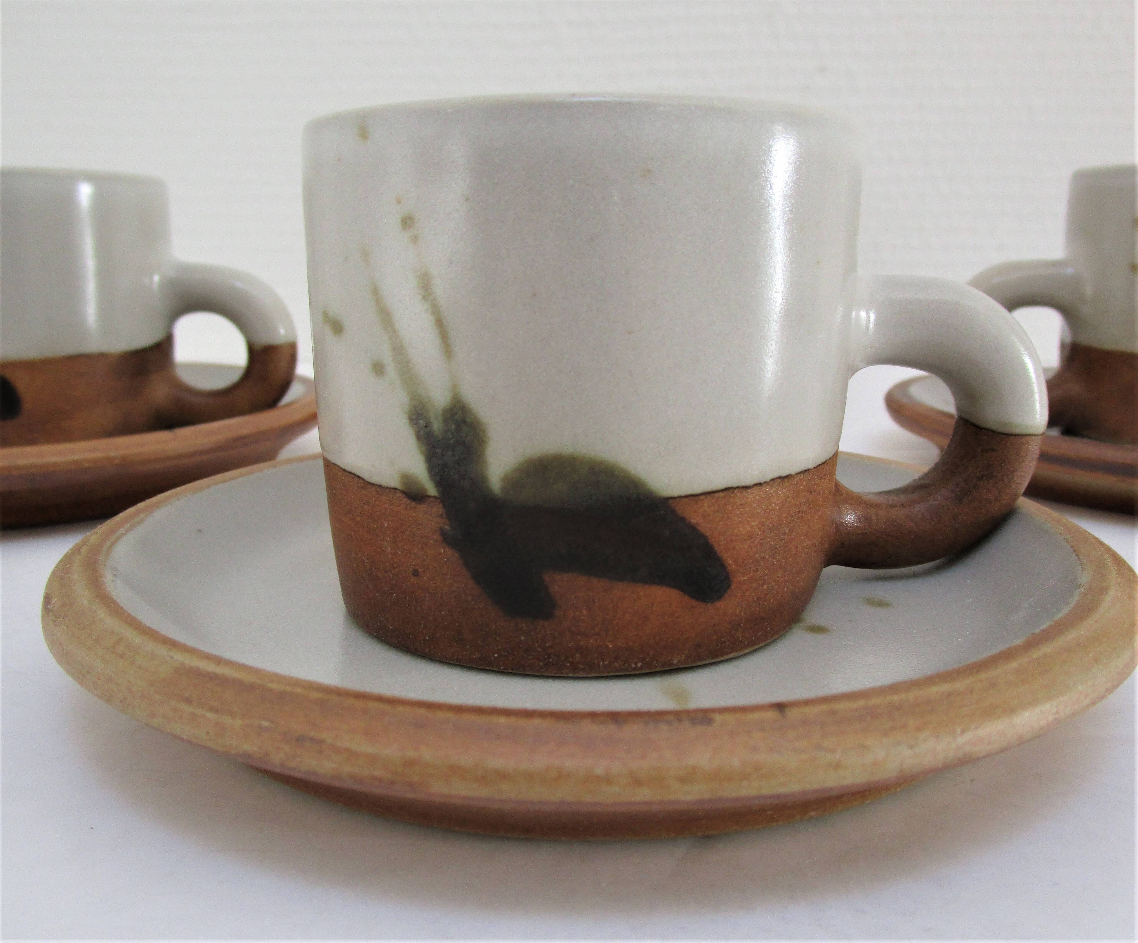 Four pottery cups and saucers from La Colombe Vallauris