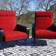 Vintage armchairs in red and black faux leather, the pair.
