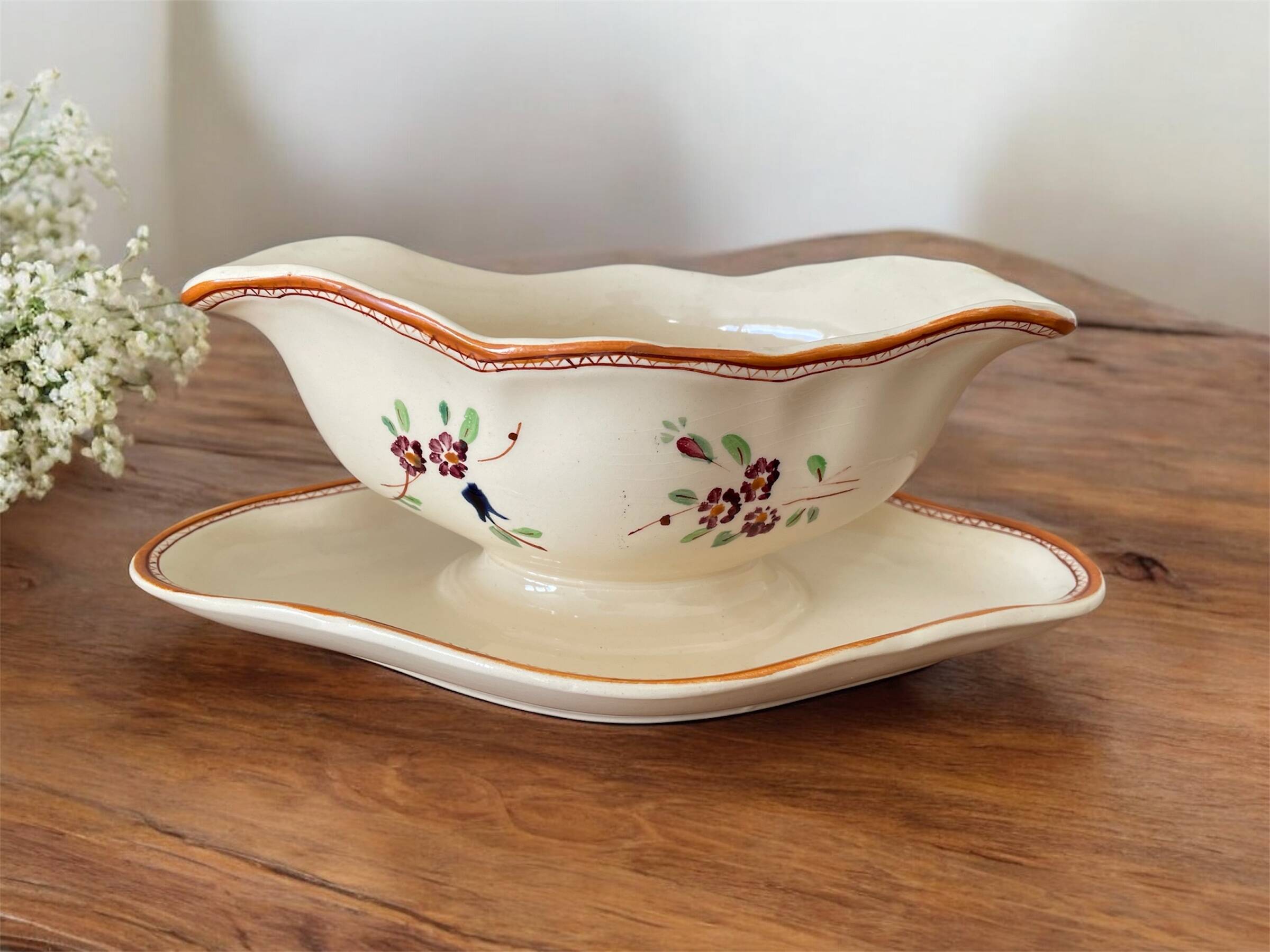 Large antique sauceboat in Longchamp earthenware.