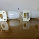 Pair of "streamline" opaline wall lights, France, 1970s-1980s.