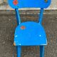 Child's chair in vintage or rustic wood style from the 1960s.