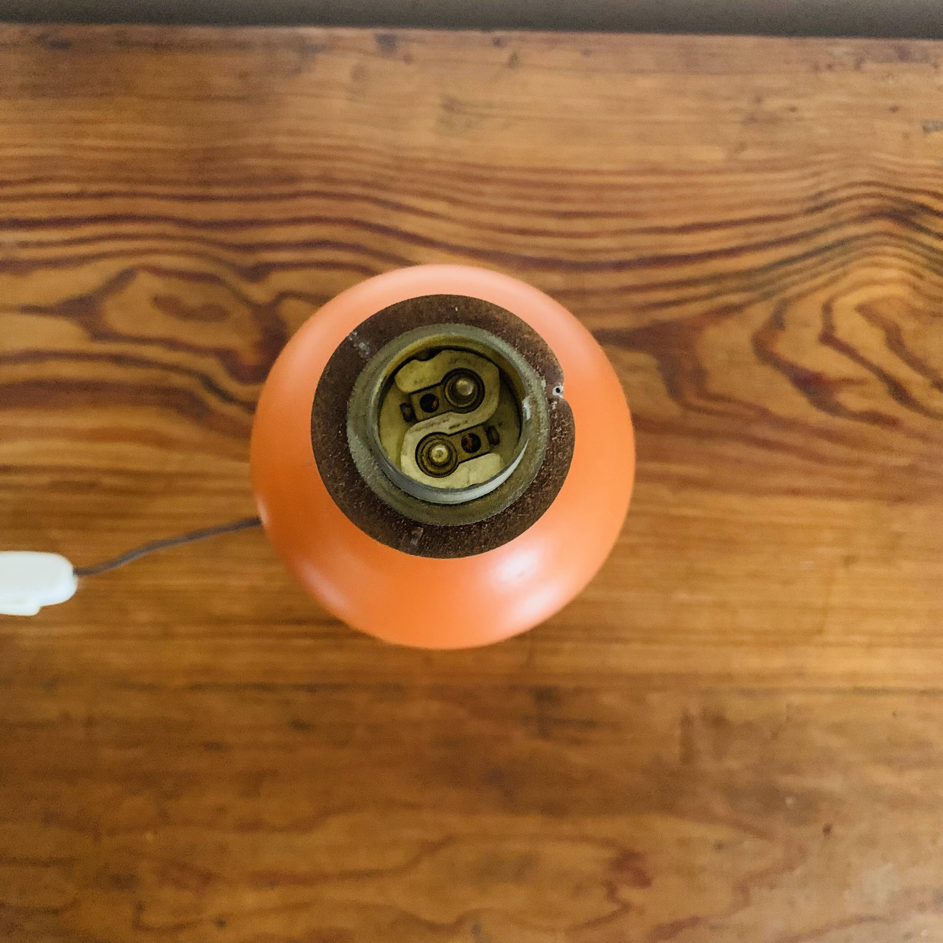 Orange turned wooden lamp base