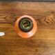 Orange turned wooden lamp base
