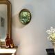 Oval mirror in gilded wood