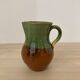 Green and brown ceramic pitcher
