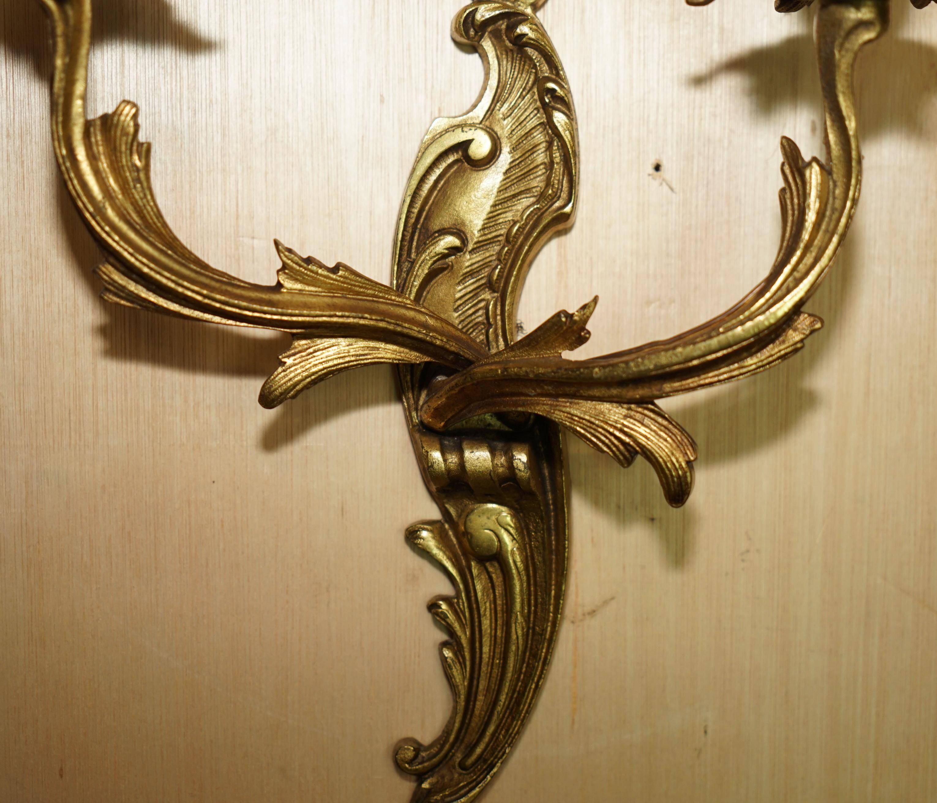 Pair of antique French wall sconces, gilded and bronzed, from the 1920s.