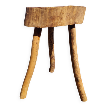 Rustic three-legged stool in minimalist wood in the style of Touret.