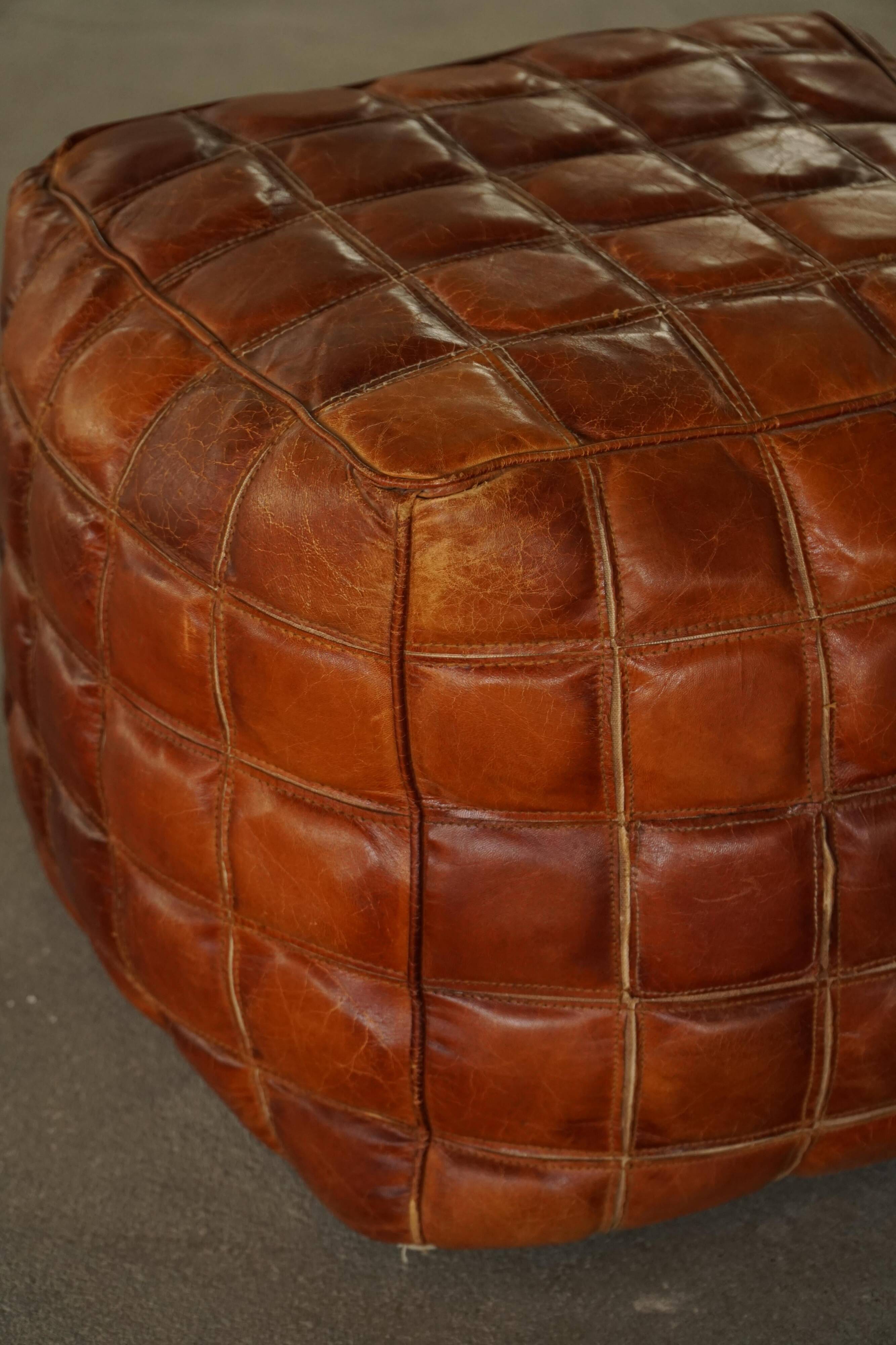 Mid-20th century pouf / ottoman cube in patinated brown leather, 1960s.