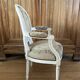 Upholstered armchair with cross-stitch in the Louis XVI style, 19th century.