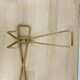 Wall coat rack with golden metal hook from the 1950s