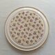 Vintage round trivet, ideal for adding a romantic touch.