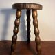 Round wooden tripod stool