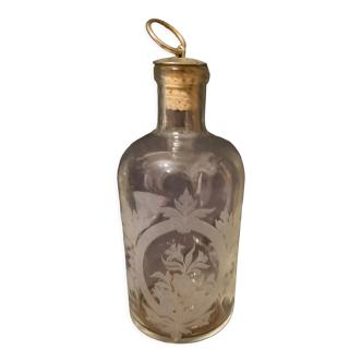 Engraved glass bottle