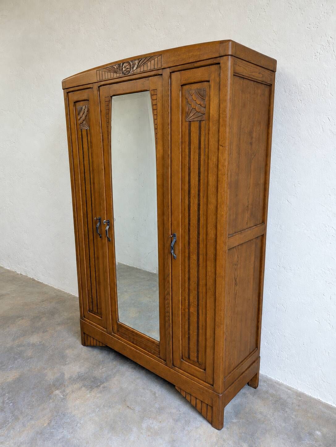 Art Deco oak wardrobe with three doors and bevelled mirror.