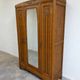 Art Deco oak wardrobe with three doors and bevelled mirror.