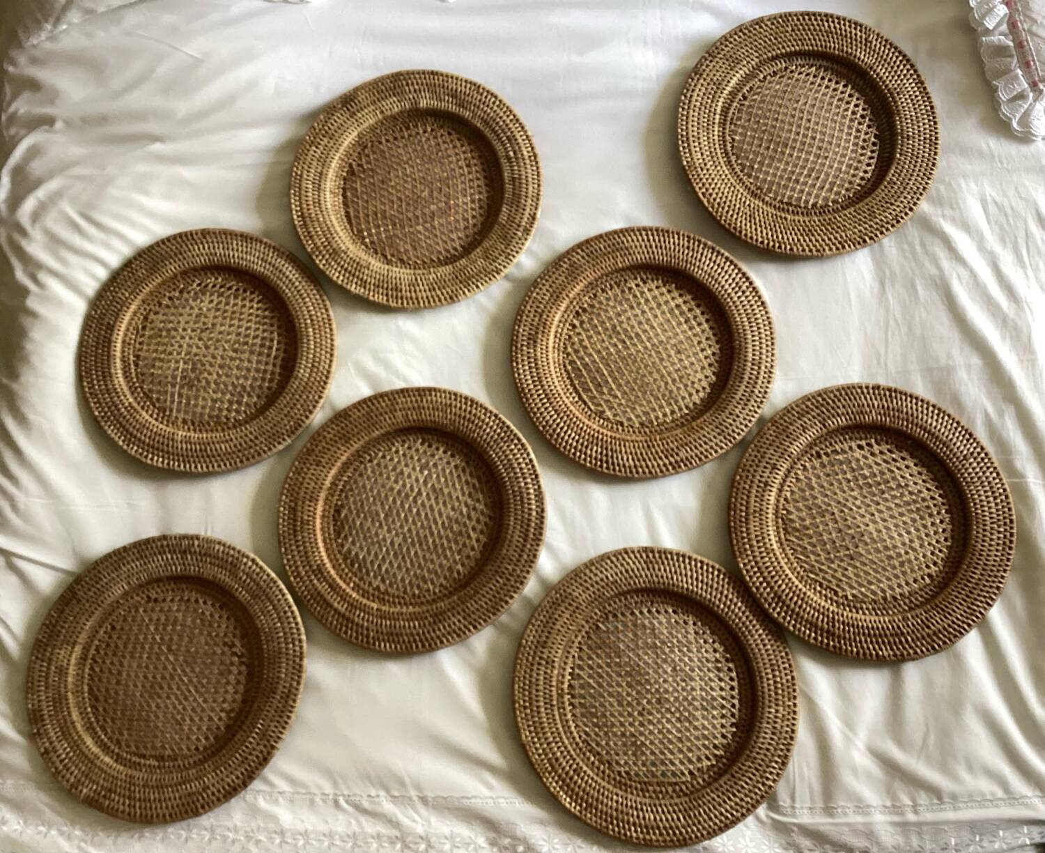 Set of round woven rattan and canework coasters