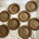 Set of round woven rattan and canework coasters