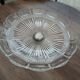 Compotier in molded glass and regulated foot
