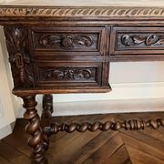 Louis XIII oak writing desk with carved twisted legs, late 19th century.