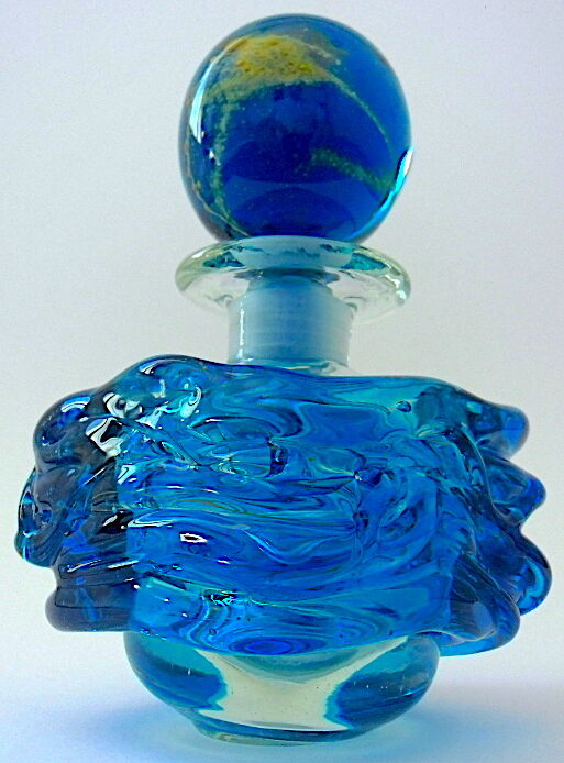 Blown blue glass bottle with inclusions