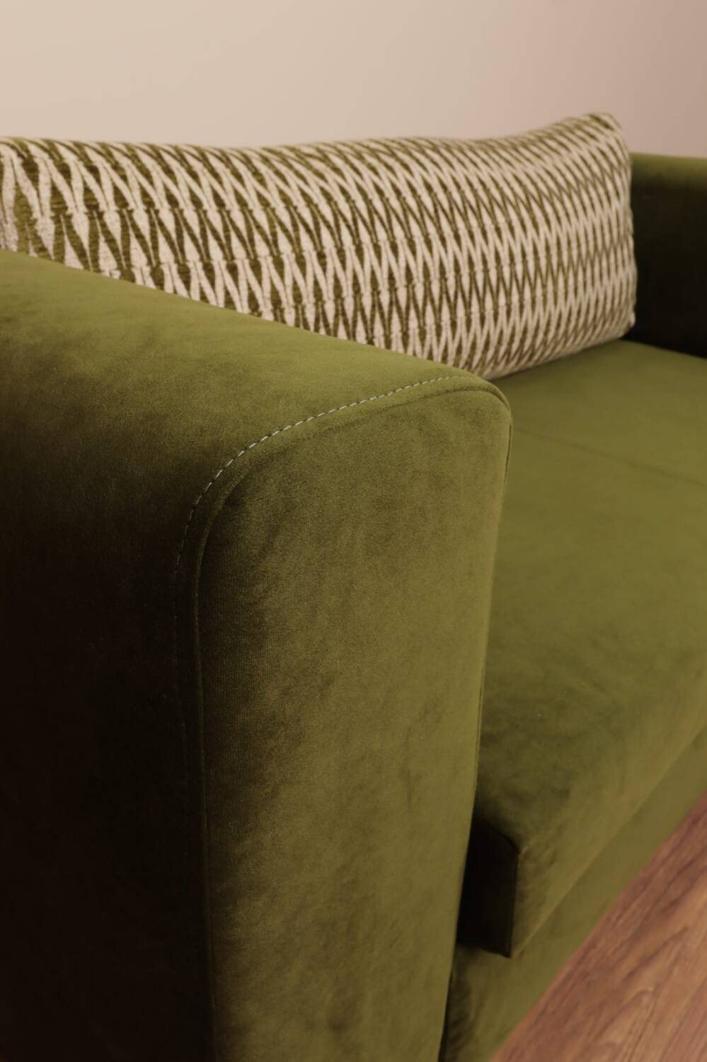 Olive velvet two-seater sofa