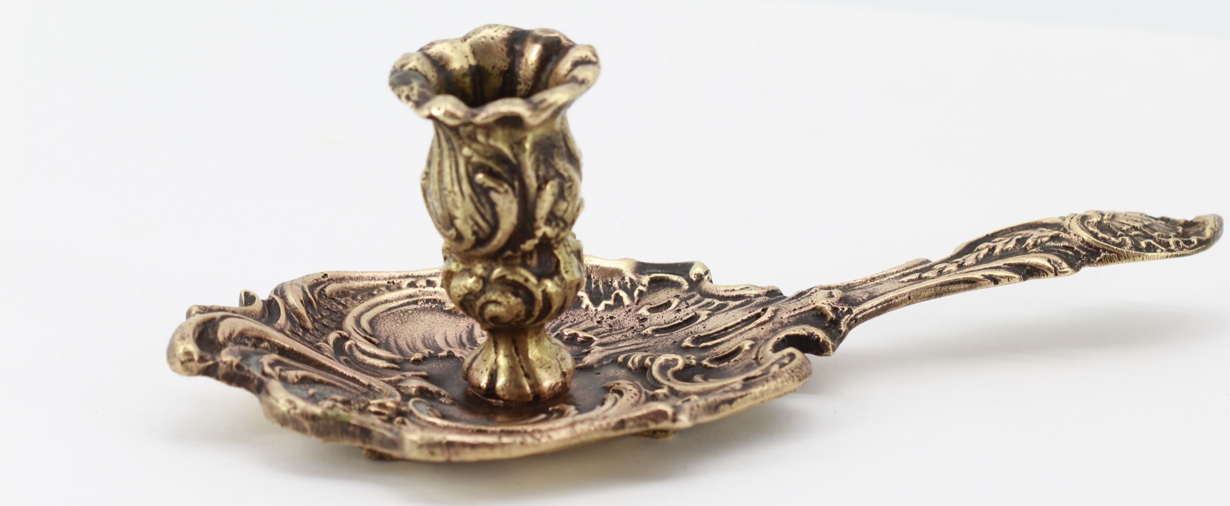 Old brass hand candle holder