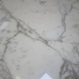 Tulip dining table in marble by Eero Saarinen for Knoll International.