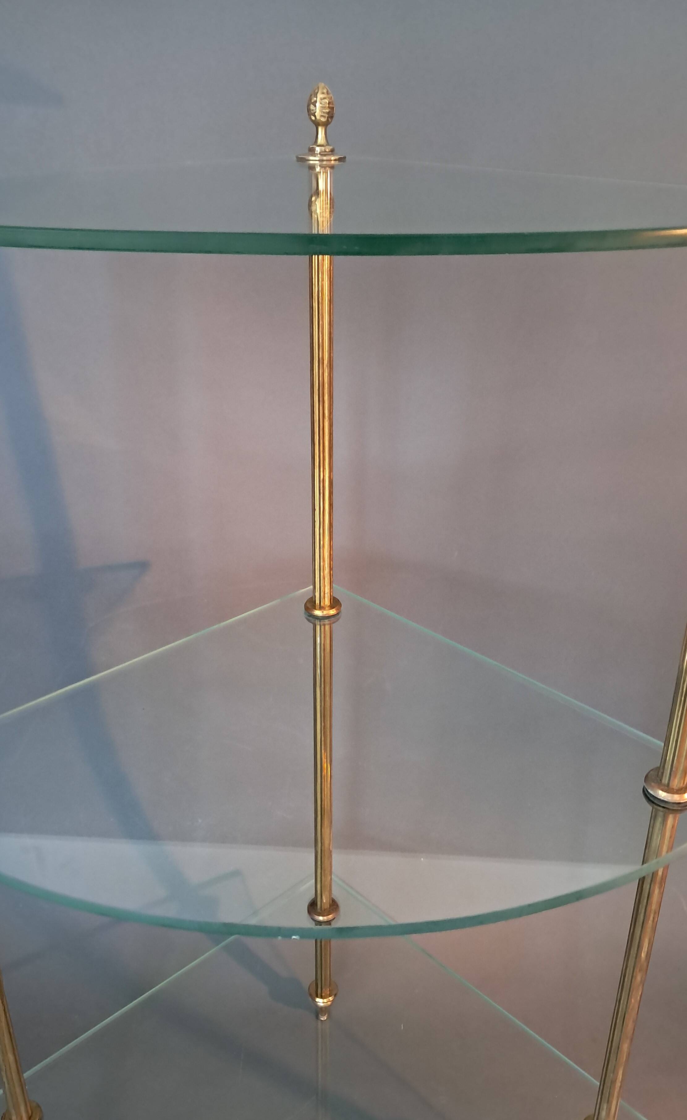 Neoclassical style 3-shelf corner cupboard in gilded brass, Circa 1950/1960.