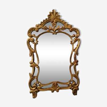 Antique mirror with Louis XV style beads in gilded wood