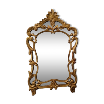 Antique mirror with Louis XV style beads in gilded wood