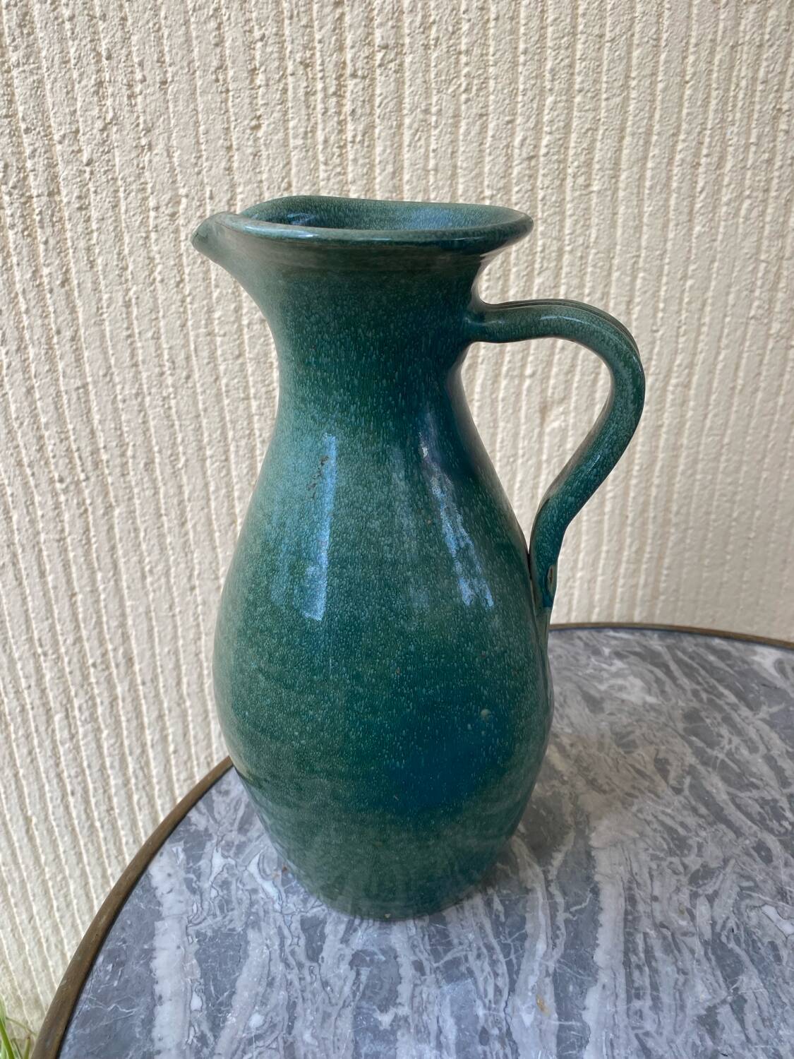 Vintage blue-green enamelled earthenware carafe