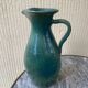 Vintage blue-green enamelled earthenware carafe