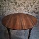 Antique drop-leaf dining table in walnut, France, circa 1900.