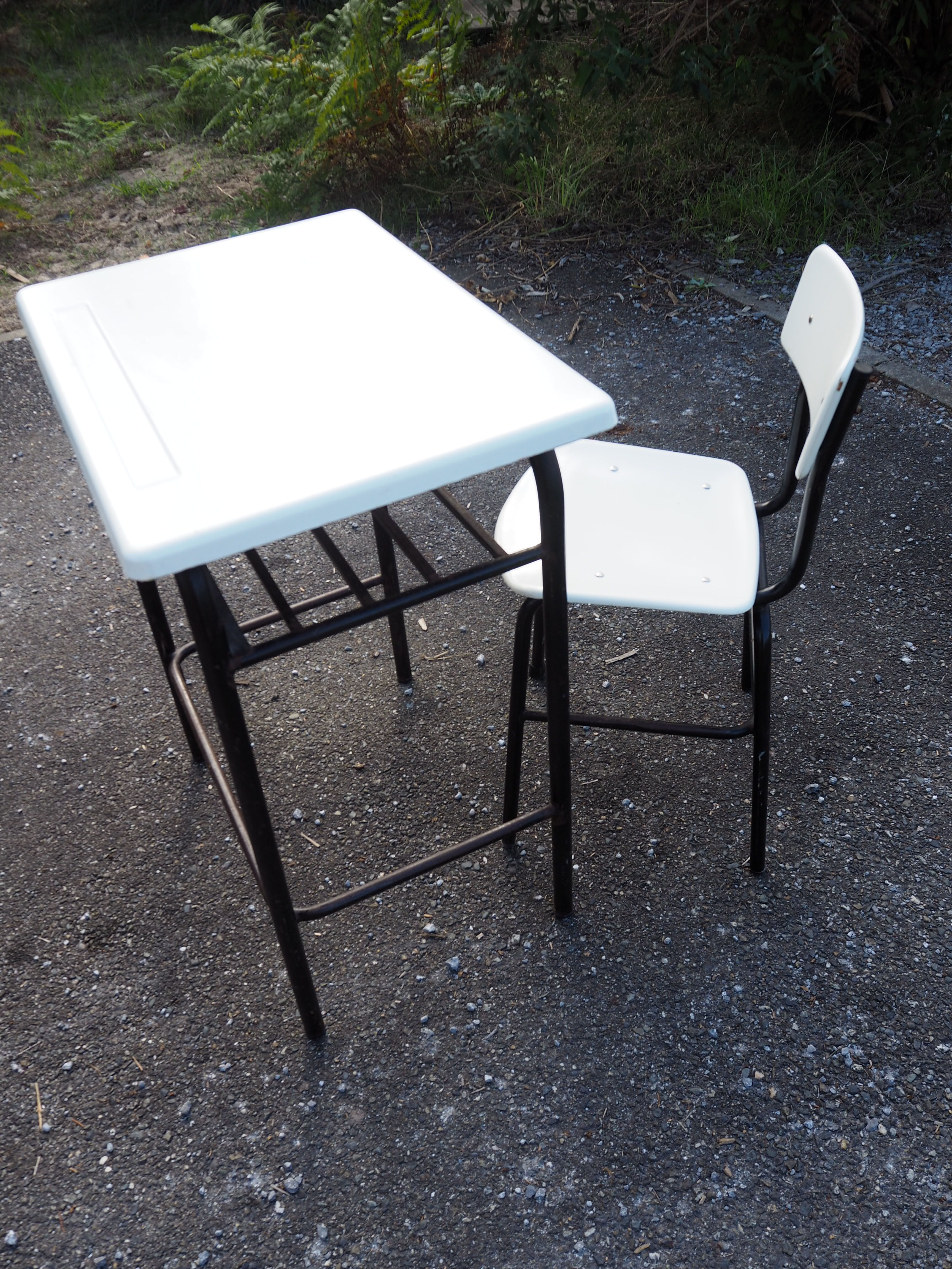 Schoolboy style desk with its white adult size chair