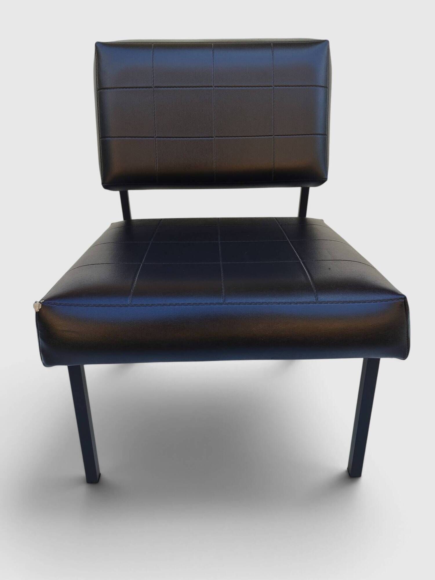 Modernist armchair in black faux leather and metal – 1960s