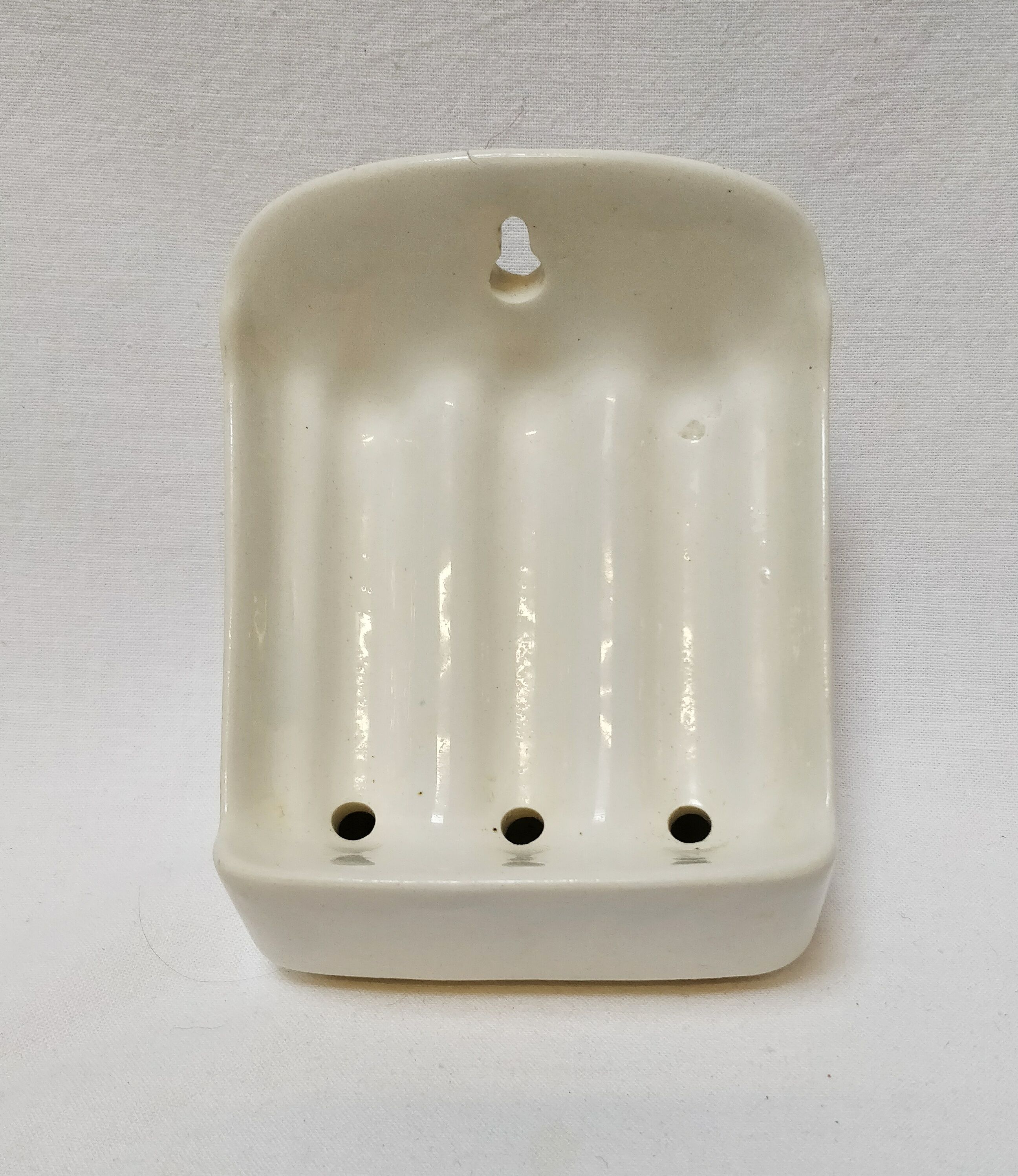 Wall-mounted ceramic soap holder