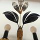 Black and gold Hollywood Regency leaf wall sconce