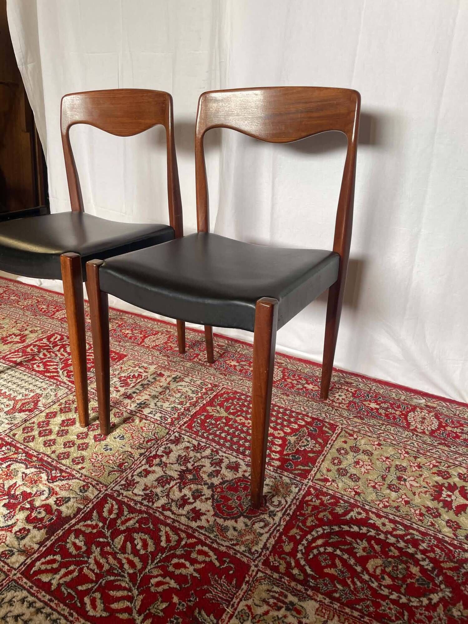 Pair of vintage teak chairs with black faux leather – Scandinavian style