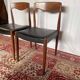 Pair of vintage teak chairs with black faux leather – Scandinavian style