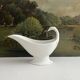 Empire sauce boat with eagle head in antique porcelain
