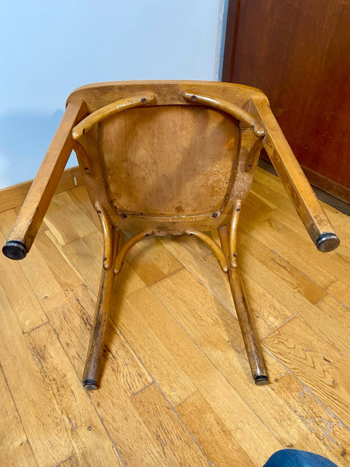 Antique curved wooden armchair in Baumann style