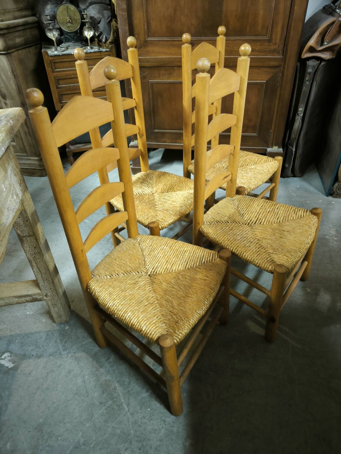 Set of 4 low straw-seated chairs circa 1940