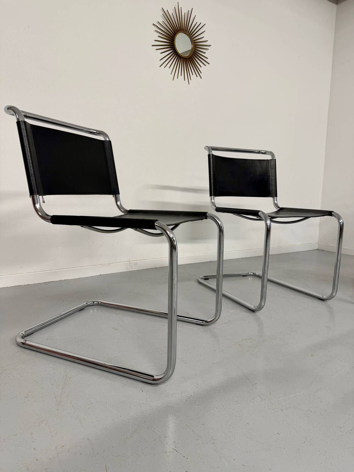 Lot of 4 tubular chairs designed by Mart Stam in vintage black leather from the 1980s.