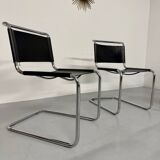 Lot of 4 tubular chairs designed by Mart Stam in vintage black leather from the 1980s.