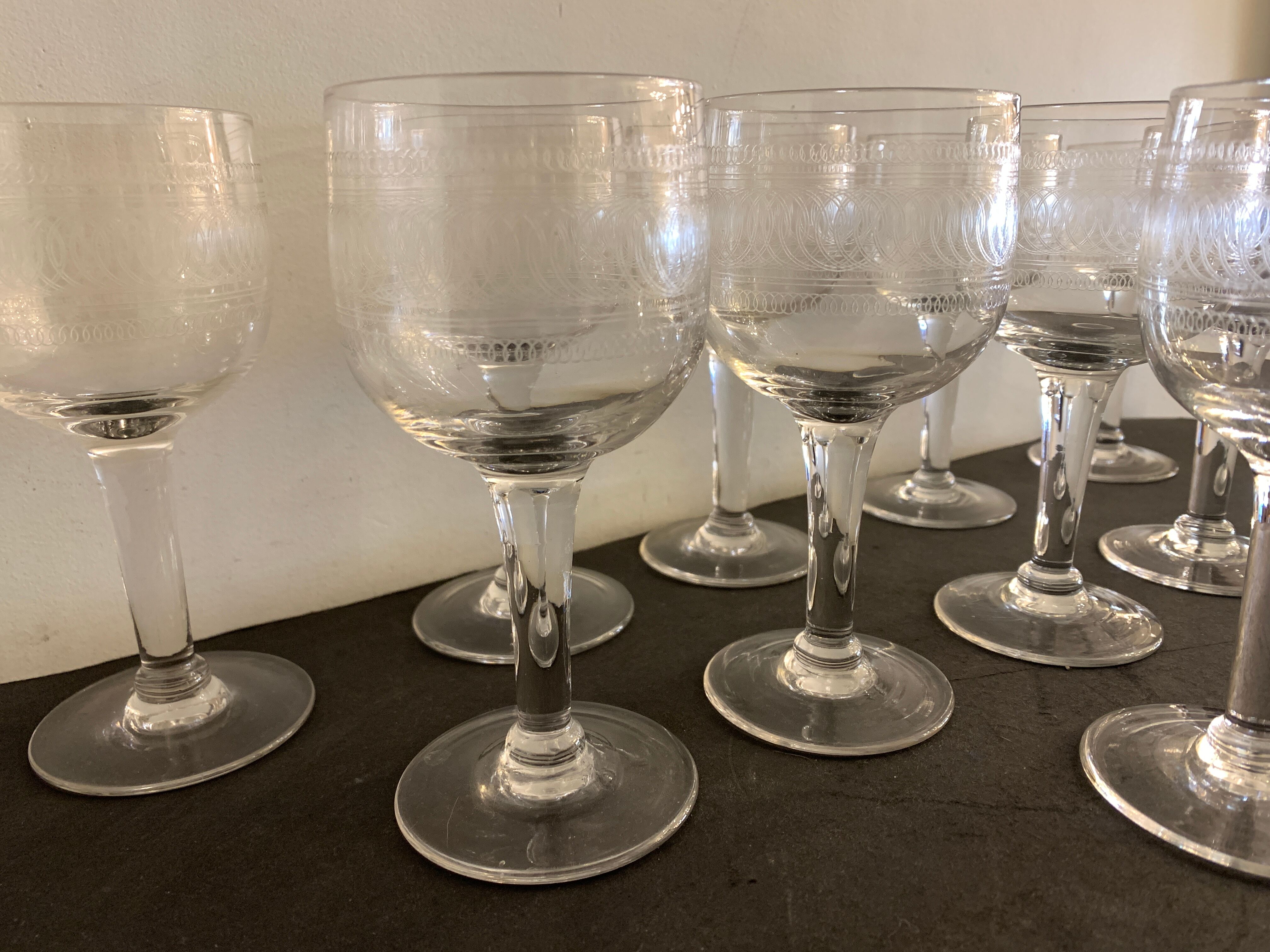 10 blown and engraved stemmed glasses