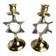 Pair of silver and gold metal candlesticks
